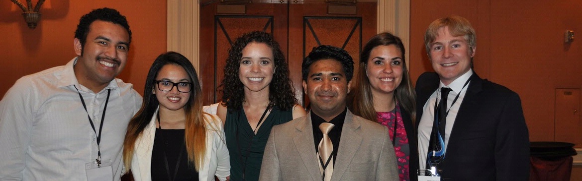 Young hospitality professionals networking at an HFTP event.